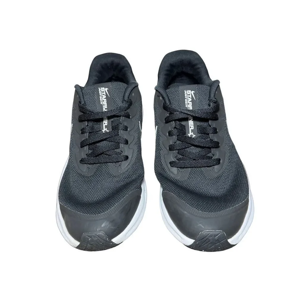 Nike women’s Black and White Low-Top Running Shoe size 5.5Y